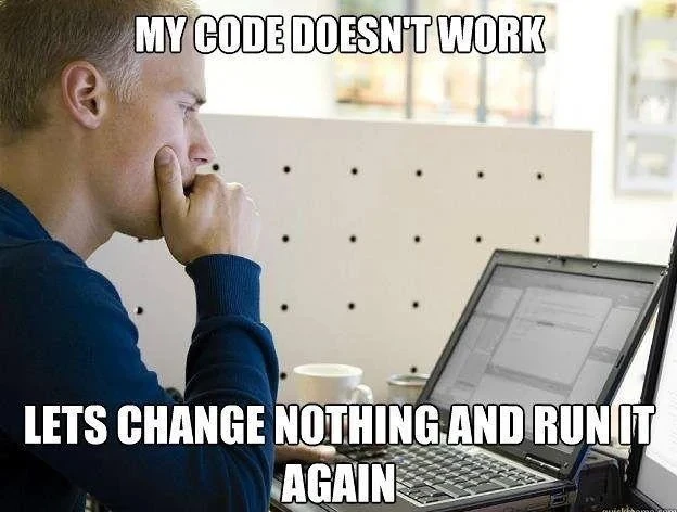 Man in an office environment staring at a laptop with a development environment showing. Over-layed text says: My code doesn't work. Let's change nothing and run it again".
